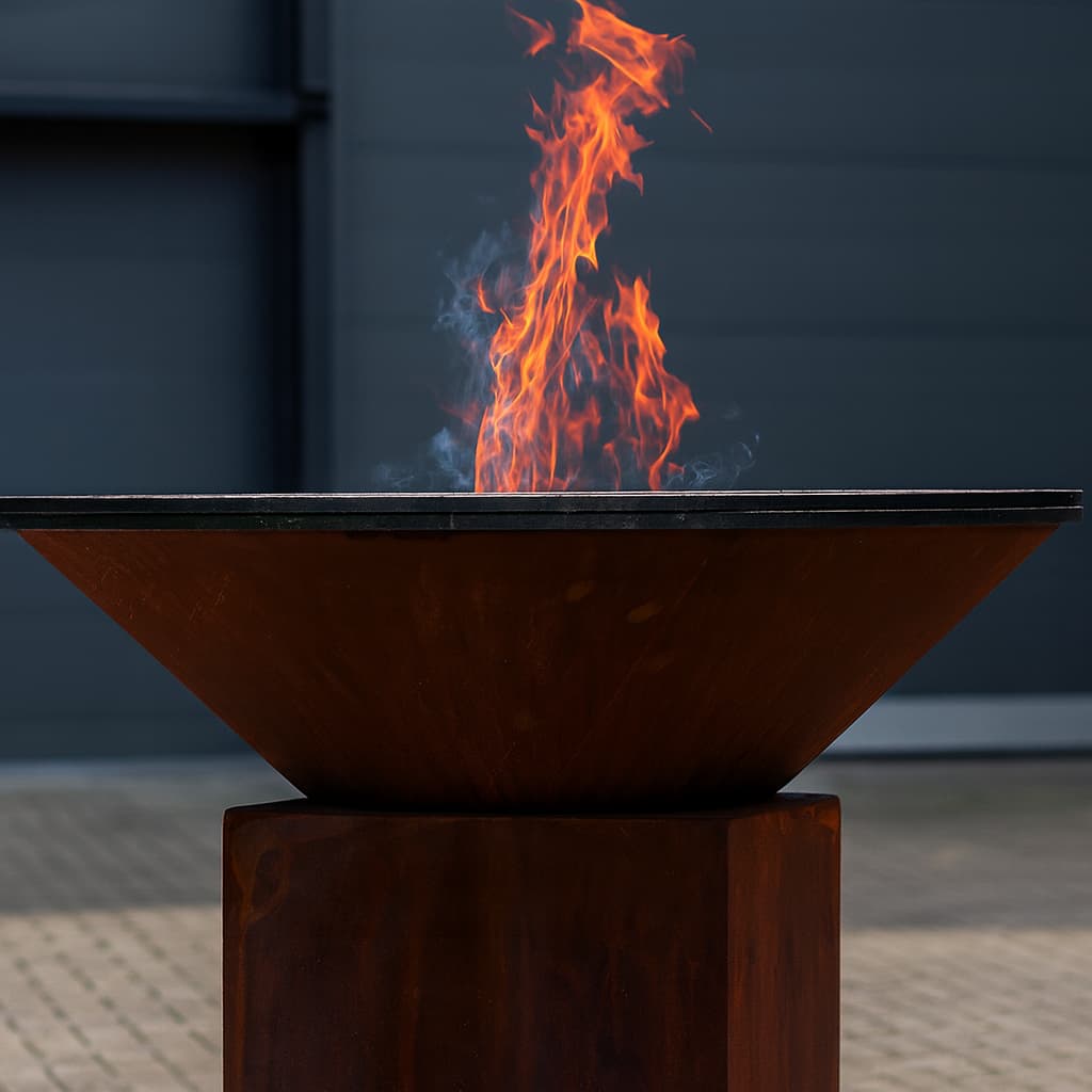 FJARVIK live-fire detail with central flame and circular cooking plate
