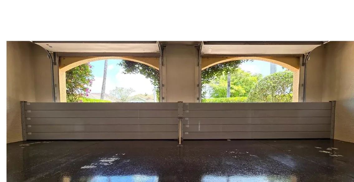 Demountable aluminium flood barrier installed across a wide opening