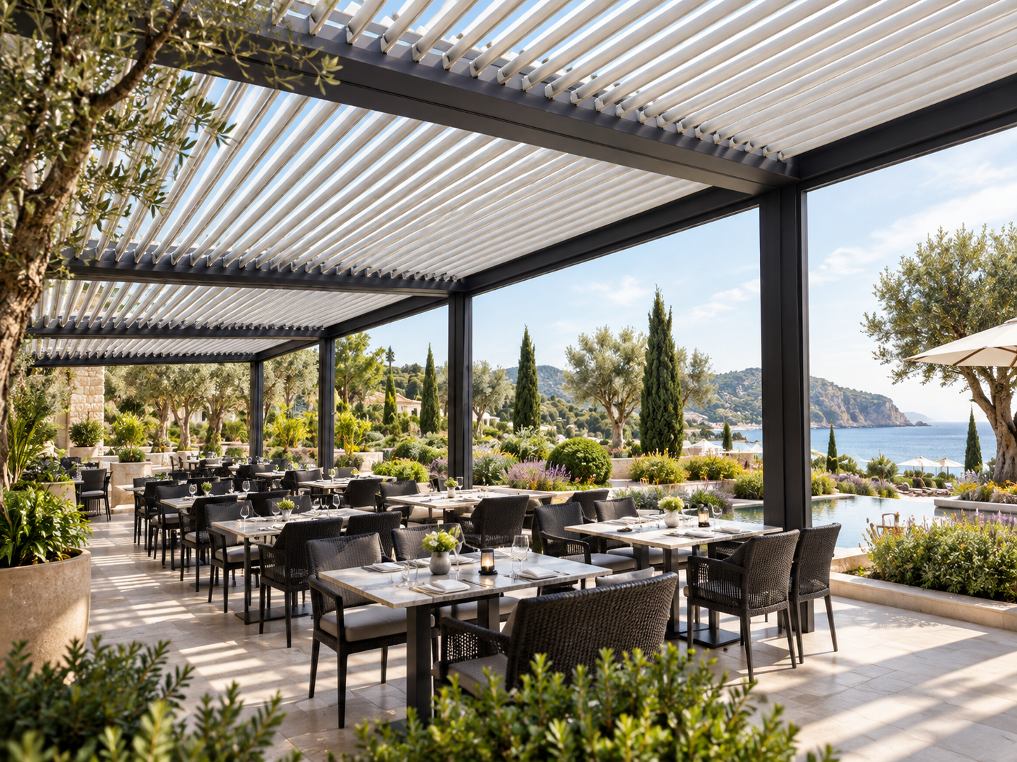 Commercial aluminium louvre roof over a landscaped resort restaurant terrace