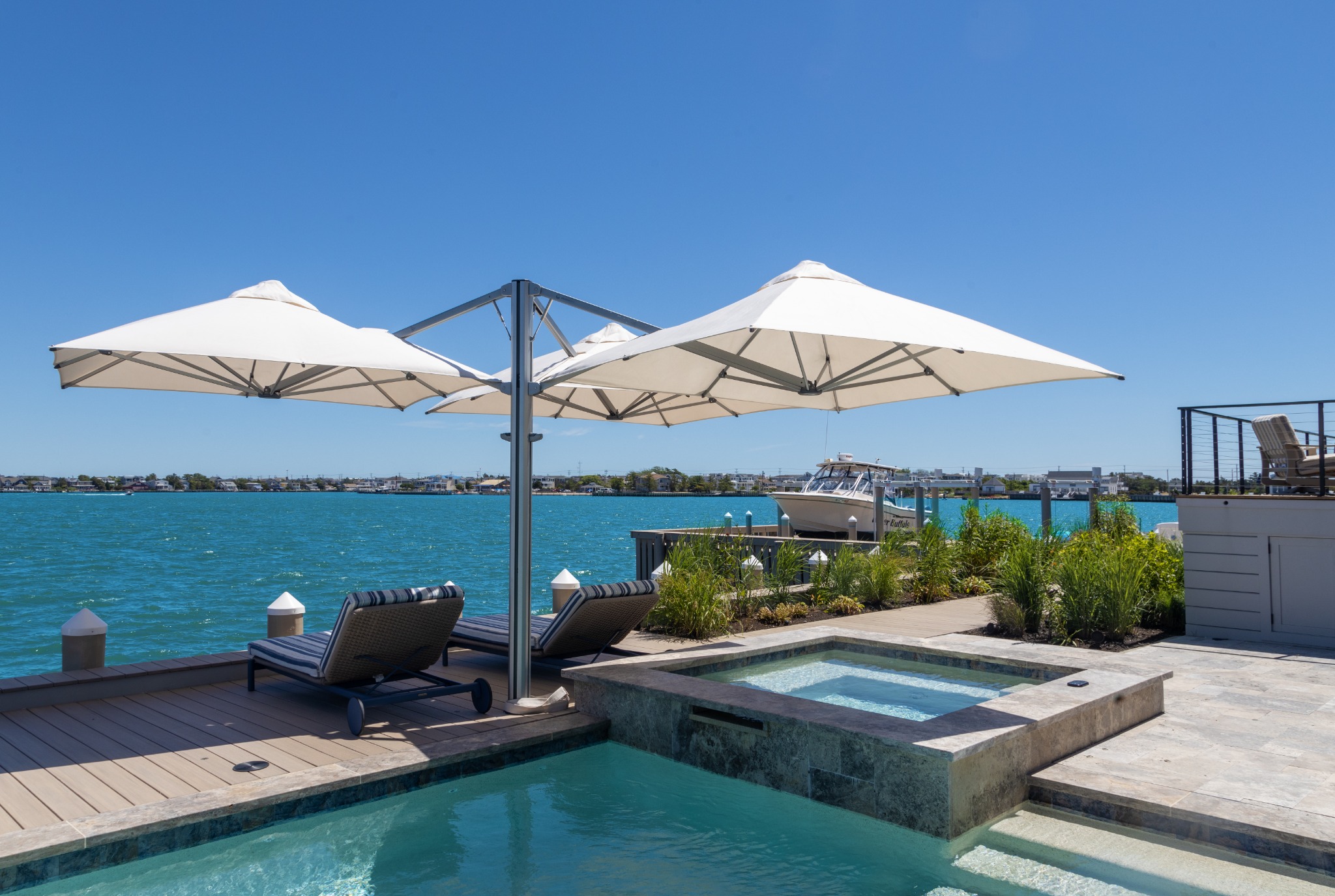 Shadowspec UNITY multi-canopy umbrella shading a large pool terrace