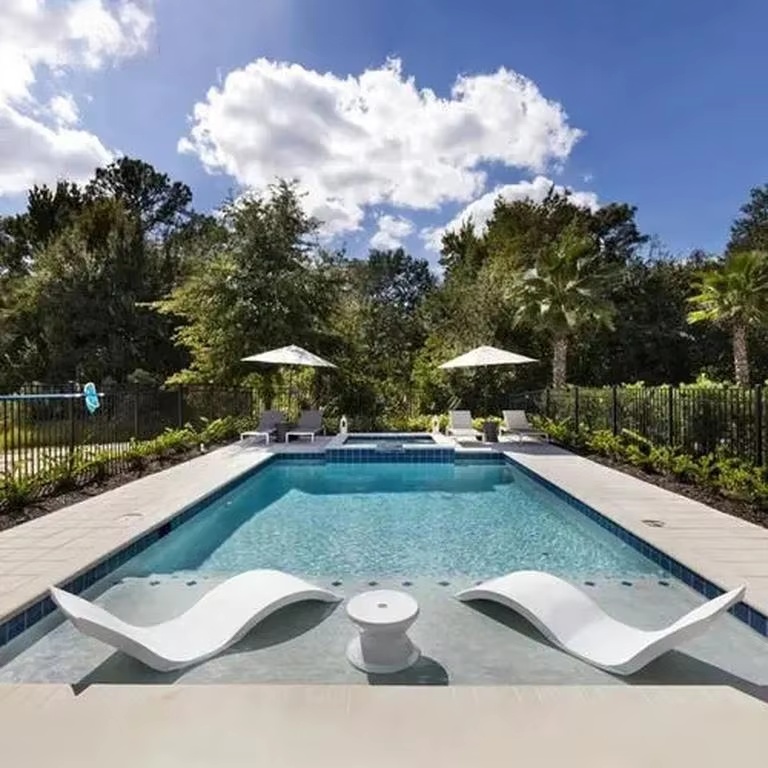 Pool with a shallow Baja shelf and in-pool loungers