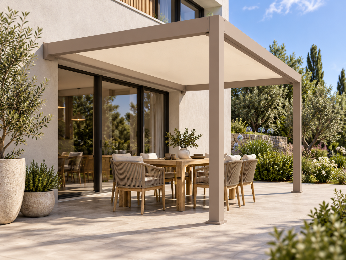 Wall-attached CADARN FRAME with a fitted fabric shade over an outdoor dining terrace