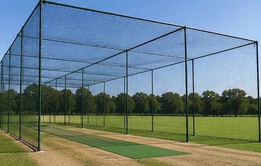 Multiple cricket practice cages side by side